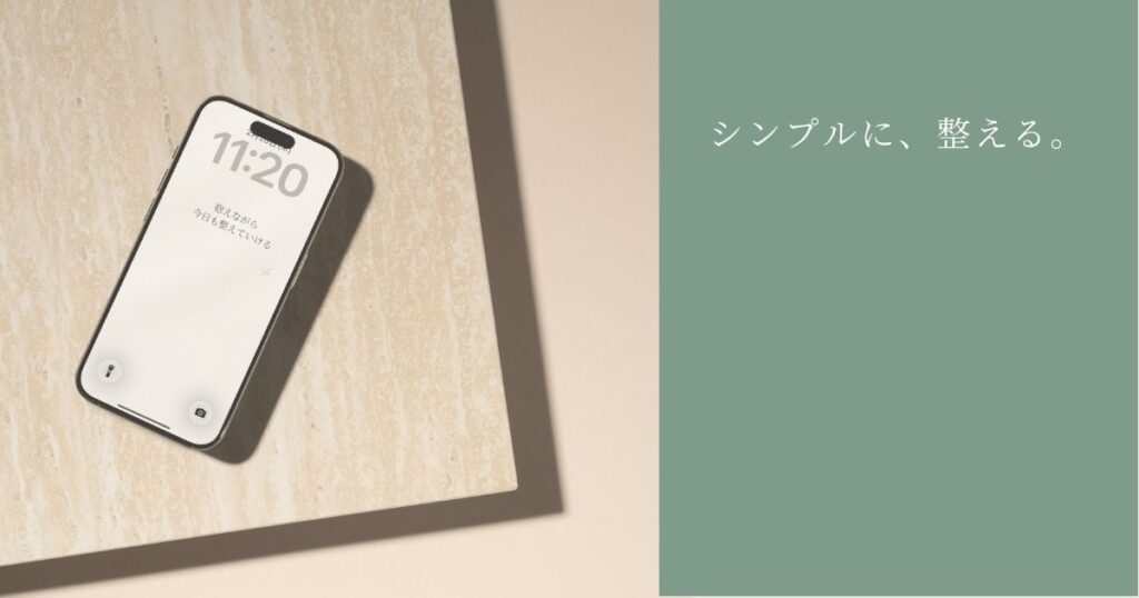 デスクにおいたスマホに設定した3月壁紙(シンプル)の使用イメージ